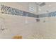 Updated shower with pebble floor and tiled walls at 124 Ventana Way, Venice, FL 34292