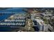 Breathtaking aerial view of a marina with numerous boats docked, a bridge, and city buildings along the water at 1600 1St W Ave # 304A, Bradenton, FL 34205