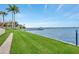 Waterfront condo with dock and lush green grass to the water at 1600 1St W Ave # 304A, Bradenton, FL 34205