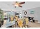 Open-concept dining area featuring glass table, decorative chairs, and a view of the bright and airy living space at 1600 1St W Ave # 304A, Bradenton, FL 34205