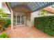 The building's entrance is well-maintained and inviting, with mature landscaping and a convenient covered awning at 1600 1St W Ave # 304A, Bradenton, FL 34205
