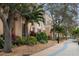 Beautifully landscaped grounds with mature trees surround this building, creating a serene and inviting atmosphere at 1600 1St W Ave # 304A, Bradenton, FL 34205