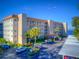The exterior shows well-maintained landscaping, covered parking, and a glimpse of the beautiful waterfront view at 1600 1St W Ave # 304A, Bradenton, FL 34205