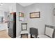 Eat-in kitchen area with black refrigerator and casual seating, perfect for quick meals at 1600 1St W Ave # 304A, Bradenton, FL 34205