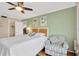 Comfortable main bedroom with a ceiling fan, walk-in closet, and ensuite bathroom at 1600 1St W Ave # 304A, Bradenton, FL 34205