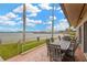 Relaxing outdoor patio area with a dining table set, offering scenic water views and a serene atmosphere at 1600 1St W Ave # 304A, Bradenton, FL 34205