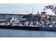 Picturesque waterfront marina view featuring docked boats, a bridge, and charming buildings along the water's edge at 1600 1St W Ave # 304A, Bradenton, FL 34205