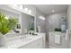 Elegant bathroom with double vanity, marble tiled shower, and modern fixtures for a spa-like experience at 2722 Sapphire Blue Ln, Bradenton, FL 34211