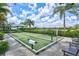 Outdoor bocce ball court surrounded by lush landscaping at 2722 Sapphire Blue Ln, Bradenton, FL 34211