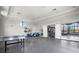 Recreation room with ping pong table, fitness equipment, and views into the weight room at 2722 Sapphire Blue Ln, Bradenton, FL 34211