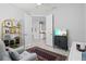 Living room with a comfortable chair, television, and a view to another room at 2722 Sapphire Blue Ln, Bradenton, FL 34211