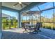 Screened patio with dining furniture, offering a relaxed and bug-free outdoor living at 2722 Sapphire Blue Ln, Bradenton, FL 34211