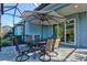 Patio featuring a large umbrella, dining furniture, and view to the backyard at 2722 Sapphire Blue Ln, Bradenton, FL 34211