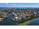 Aerial view of a waterfront community with canals, showcasing the property's convenient location and access to boating and coastal living at 3540 Bayou Cir, Longboat Key, FL 34228