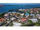 An aerial view highlighting the property's proximity to the water with a view of the pool and a neatly landscaped neighborhood at 3540 Bayou Cir, Longboat Key, FL 34228