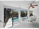 The lanai has a seating area that overlooks the pool and tropical backyard at 3540 Bayou Cir, Longboat Key, FL 34228