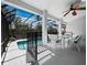 The lanai is a lovely spot for entertaining or relaxing by the screened-in pool at 3540 Bayou Cir, Longboat Key, FL 34228
