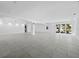Expansive living room with sleek tile flooring and natural light, perfect for entertaining and relaxing at 3540 Bayou Cir, Longboat Key, FL 34228