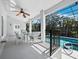 Inviting outdoor patio with dining set, perfect for enjoying the pool and tropical view at 3540 Bayou Cir, Longboat Key, FL 34228