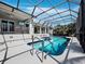 Resort-style pool with attached spa and enclosed lanai, surrounded by lush tropical landscape at 3540 Bayou Cir, Longboat Key, FL 34228