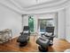 Relaxing sitting area with comfortable leather recliners and large sliding glass doors overlooking the pool at 3540 Bayou Cir, Longboat Key, FL 34228