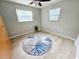 Updated bedroom featuring modern vinyl flooring, a ceiling fan, and sunlit windows at 4430 Wynkoop Cir, Port Charlotte, FL 33948