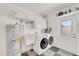 Clean laundry room with modern appliances and a utility sink at 4430 Wynkoop Cir, Port Charlotte, FL 33948