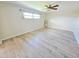 Large living room featuring modern vinyl flooring, neutral colors, and natural light at 4430 Wynkoop Cir, Port Charlotte, FL 33948