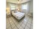 Serene bedroom with a queen-size bed, soft lighting, and a calming atmosphere at 4444 Los Rios St, North Port, FL 34287