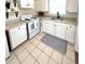 Functional kitchen with white cabinets, clean appliances, and ample counter space at 4444 Los Rios St, North Port, FL 34287