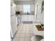 Bright kitchen features white cabinetry, modern appliances, and functional layout at 4444 Los Rios St, North Port, FL 34287