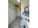 Small storage area with a water heater and tile floor at 4444 Los Rios St, North Port, FL 34287