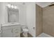Bathroom features a single sink vanity, tile flooring, and a tiled stand-up shower at 4886 Seafoam Trl, Bradenton, FL 34211