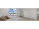 Inviting bedroom with serene lake view, plush carpeting, and neutral decor at 4886 Seafoam Trl, Bradenton, FL 34211