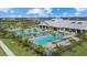 Aerial view of the community pool and recreation center, featuring swimming pools, lounge areas and playgrounds at 4886 Seafoam Trl, Bradenton, FL 34211