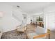 Inviting living room with modern seating, a neutral color palette, and a staircase leading to the upper level at 4886 Seafoam Trl, Bradenton, FL 34211