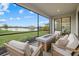 Relaxing screened patio with comfortable seating area and a view of the lake at 4886 Seafoam Trl, Bradenton, FL 34211