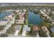 Aerial view of the neighborhood featuring lakefront homes and lush landscaping at 5383 Creekside Trl, Sarasota, FL 34243