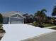 Charming one-story home with a spacious driveway and lush landscaping at 5383 Creekside Trl, Sarasota, FL 34243