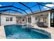 Inviting screened-in pool area with a built-in spa and fountain, plus plenty of space for lounging and entertaining at 5383 Creekside Trl, Sarasota, FL 34243