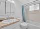 Cozy bathroom featuring a tub, shower, and vanity with good lighting at 5889 Canal Dr # I4, Bradenton, FL 34207