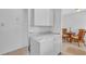 Convenient laundry area with a washer and dryer, adjacent to the dining space at 5889 Canal Dr # I4, Bradenton, FL 34207