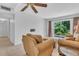 Relaxing living room with comfortable seating and view to lush outdoor greenery at 5889 Canal Dr # I4, Bradenton, FL 34207