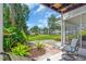 Patio with outdoor seating overlooking lush greenery and well-manicured landscaping at 5889 Canal Dr # I4, Bradenton, FL 34207