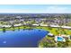 Breathtaking aerial shot of the community with a shimmering lake and inviting community pool at 6420 13Th Avenue W Dr, Bradenton, FL 34209