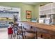 Close-up view of the bar area showcasing the countertop, seating, and decorative elements at 6420 13Th Avenue W Dr, Bradenton, FL 34209