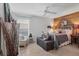 Cozy bedroom with rustic decor, wood accent wall, and a comfortable bed at 6420 13Th Avenue W Dr, Bradenton, FL 34209