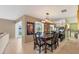 Another view of the dining room highlighting the elegant table and seating arrangement at 6420 13Th Avenue W Dr, Bradenton, FL 34209