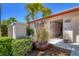 Inviting front entrance with lush landscaping and decorative ironwork at 6420 13Th Avenue W Dr, Bradenton, FL 34209