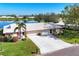 Beautiful waterfront home with lush landscaping and a long driveway at 6420 13Th Avenue W Dr, Bradenton, FL 34209